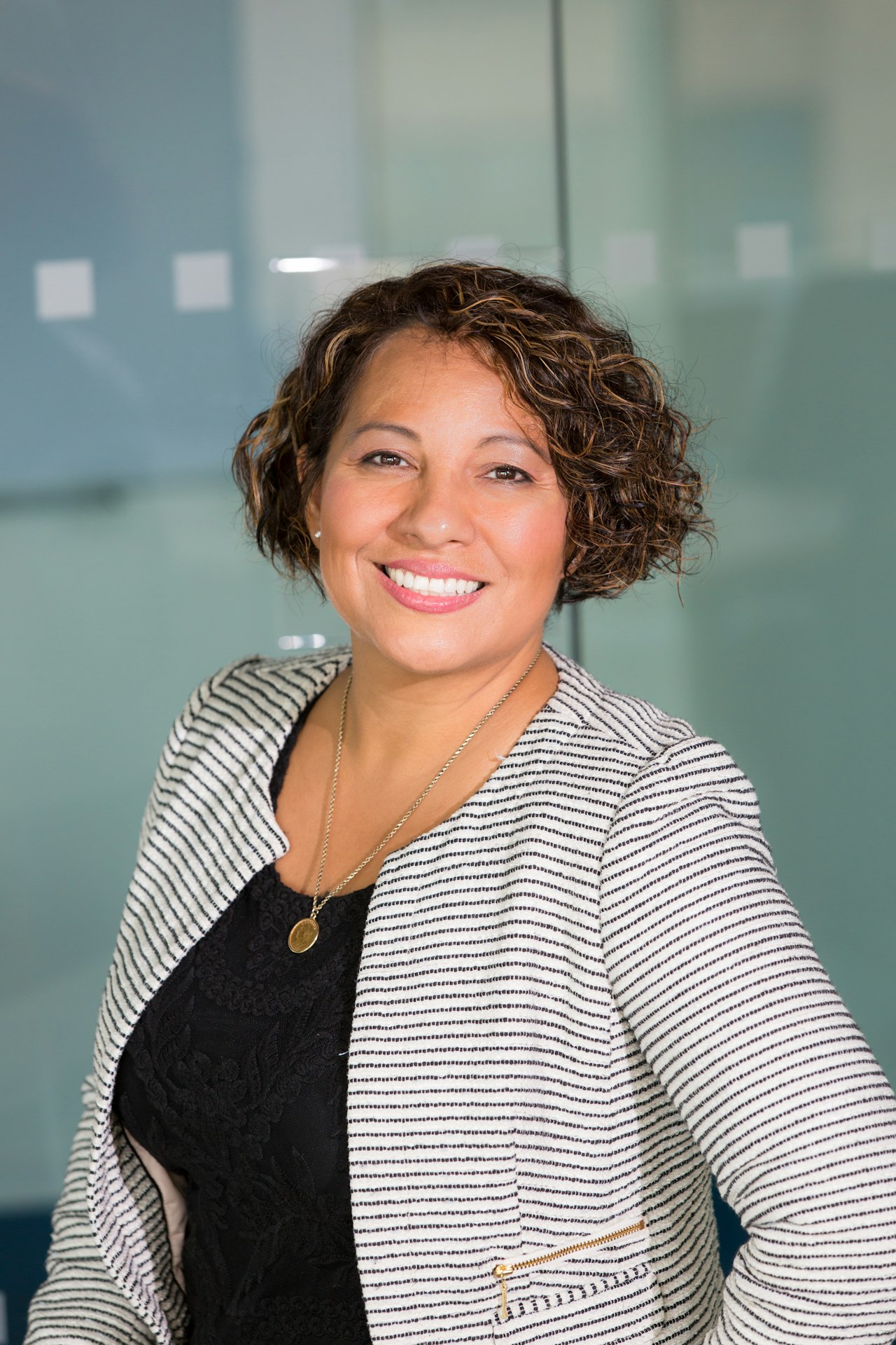 Professional woman smiling in an office